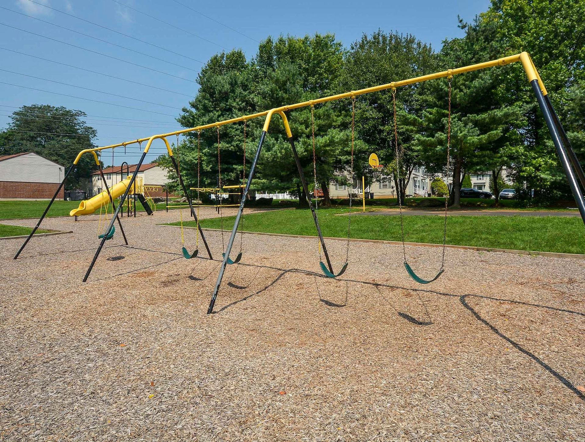 Playground with swings and a yellow slide at a residential apartment complex. Contact us today to learn more about our pet-friendly 1, 2, 3, and 4-bedroom apartments for rent in Bethlehem, PA. At River Pointe Townhomes, you’ll enjoy a prime location near Lehigh River and all the amenities and extras that make your life comfortable. We can’t wait to welcome you home!
