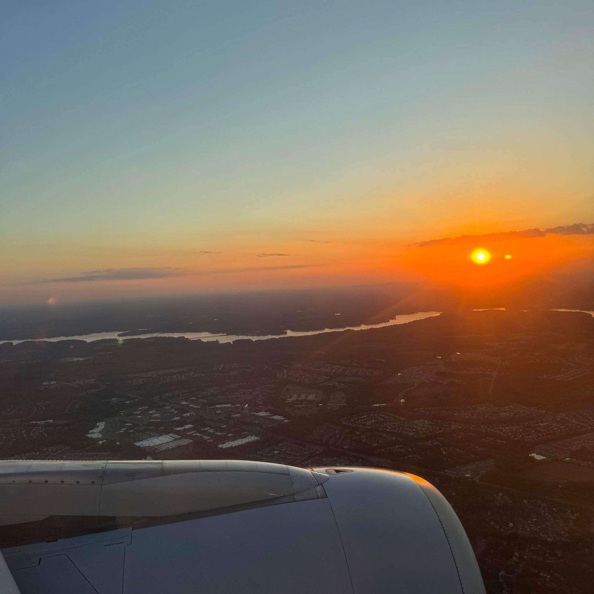 A view of a sunset from an airplane window