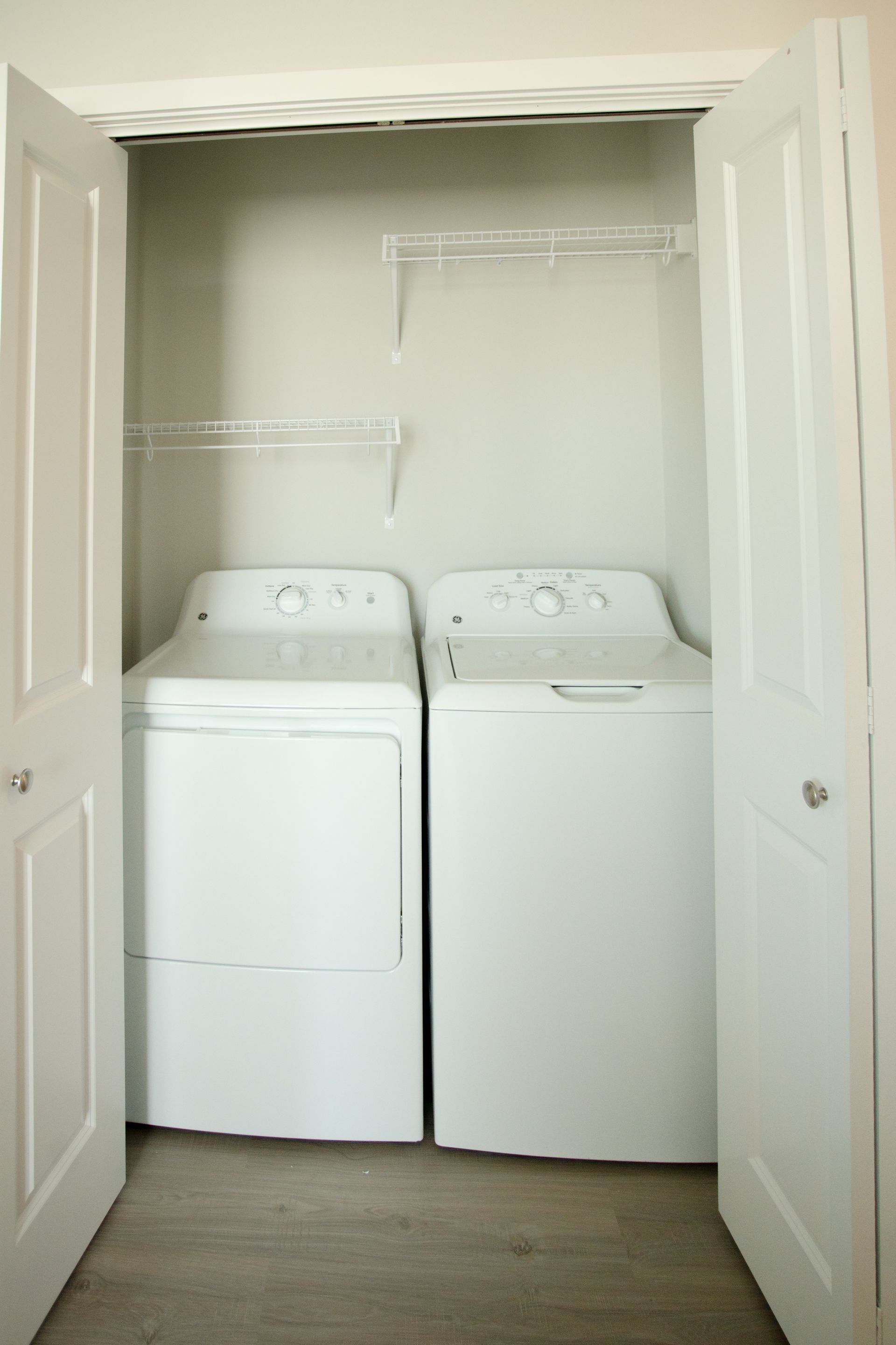 A closet with a washer and dryer in it