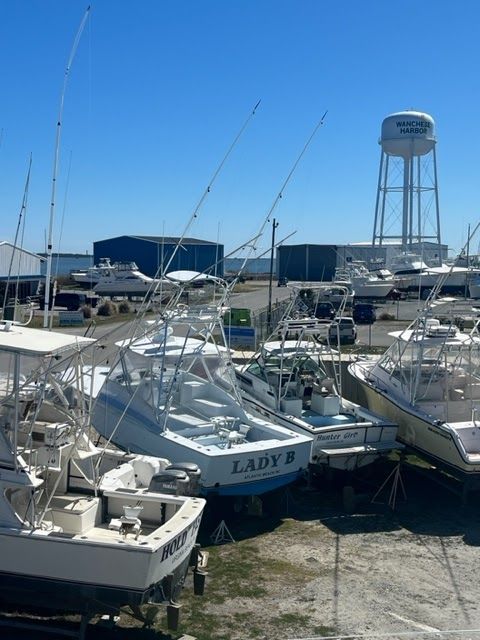 A person in a white apron is working in a kitchen