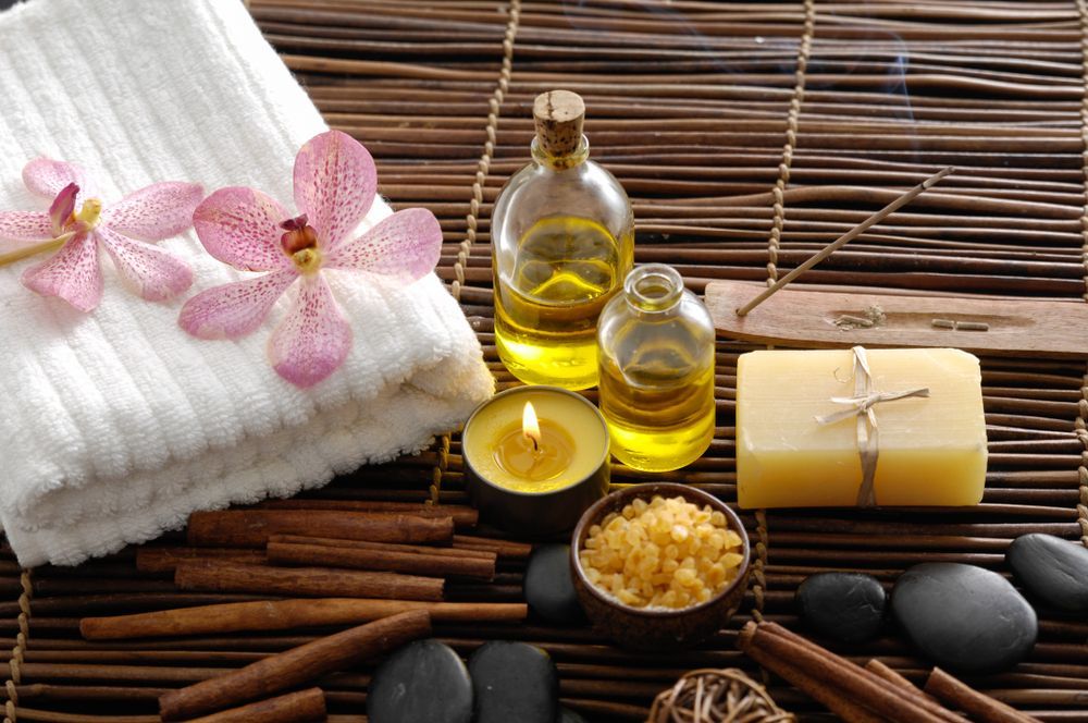 Spa Setting: Towel, Orchids, Oils, Candle, Rocks, Cinnamon Sticks — A1 Coffs Harbour in Coffs Harbour, NSW