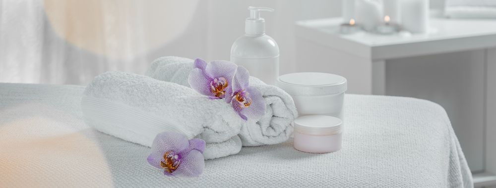 White Spa Towels, Orchids, and Skincare Products — A1 Coffs Harbour in Coffs Harbour, NSW