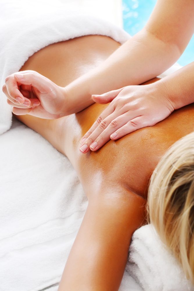 Person Receiving a Back Massage With Hands — A1 Coffs Harbour in Coffs Harbour, NSW