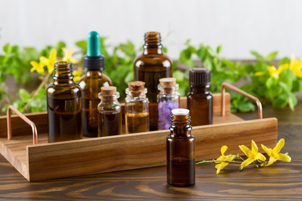 Bottles of Essential Oils in a Wooden Tray — A1 Coffs Harbour in Coffs Harbour, NSW