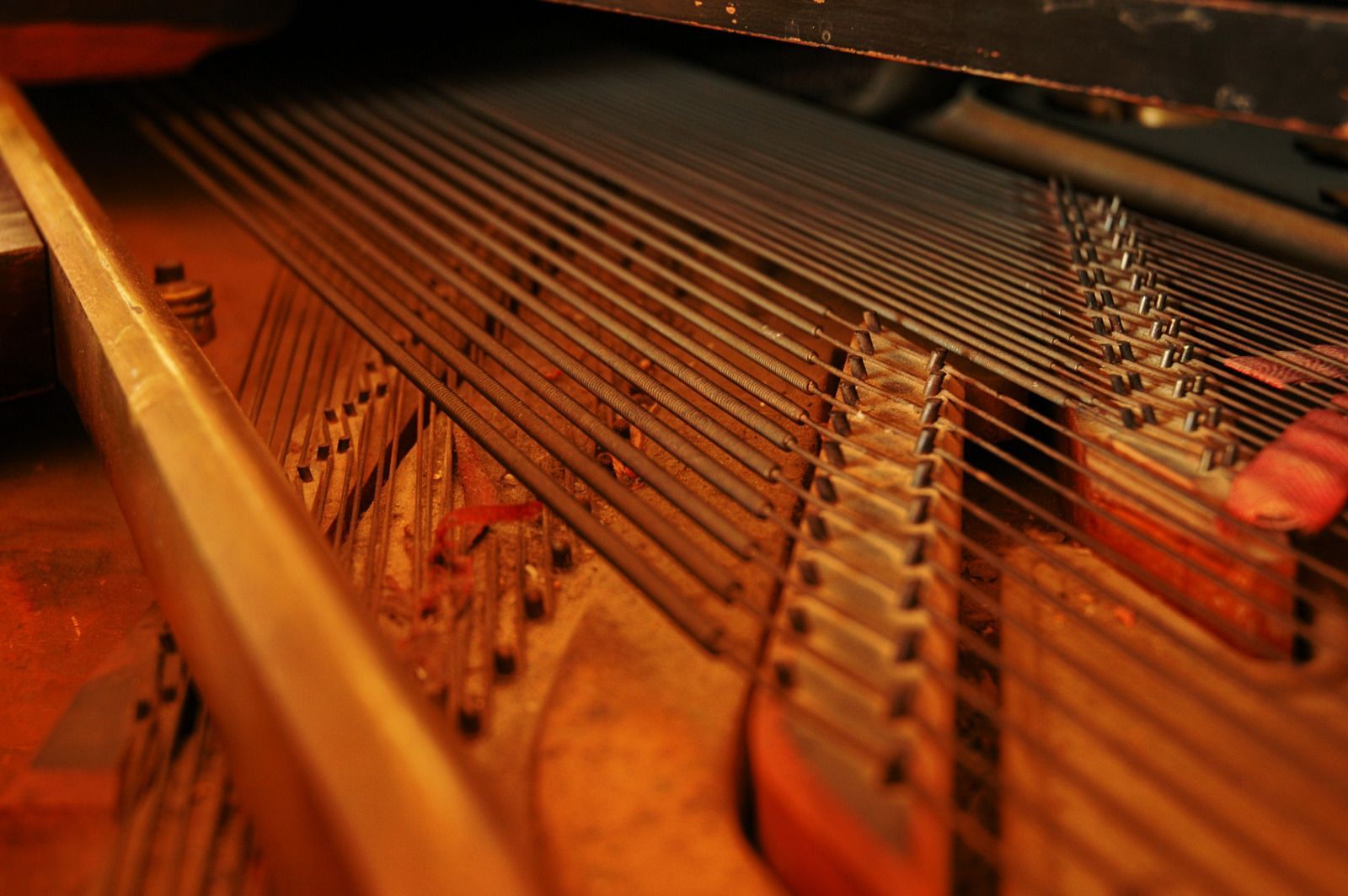 Kitchen with a wooden island, antique-style cabinet, wine rack, and green wall; hardwood floors.