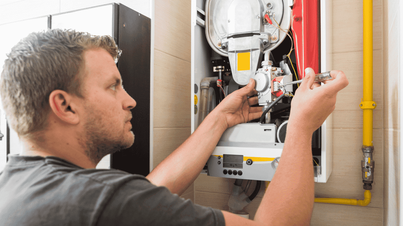 technician calibrating temperature of heating unit