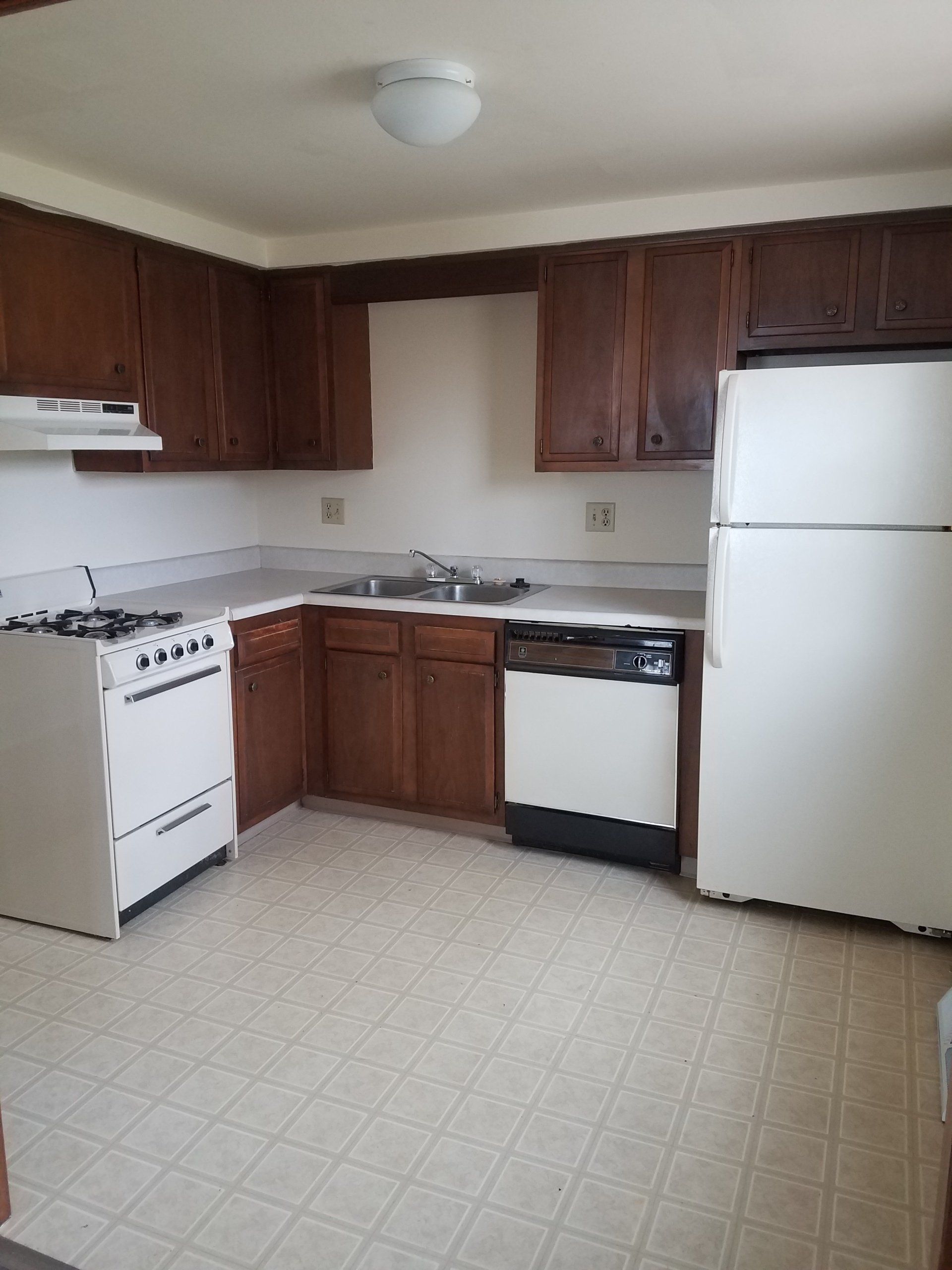 Kitchen with stove, dishwasher, and refrigerator.
