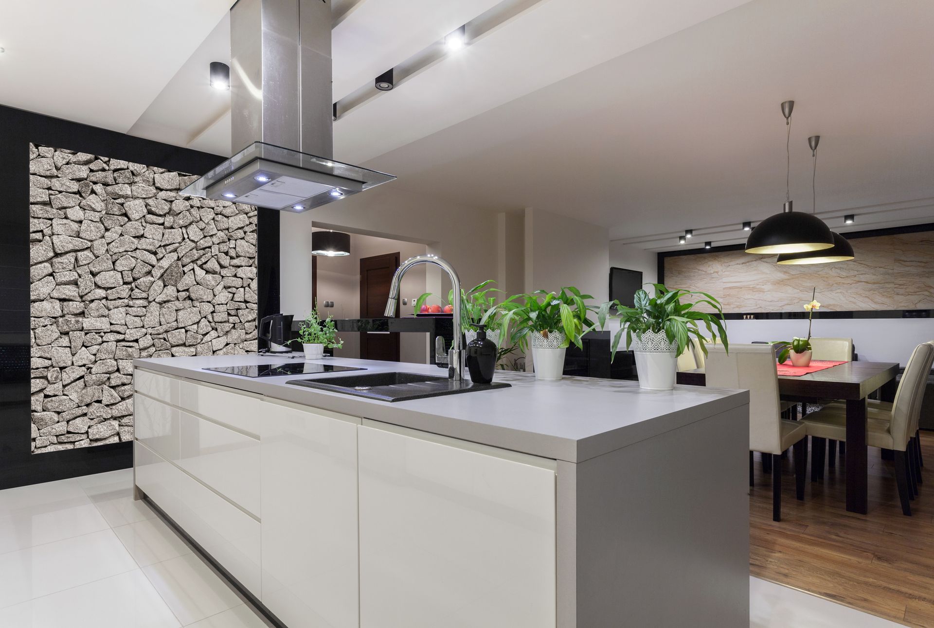 Modern kitchen showcasing elegant kitchen stone benchtops and stone wall design.