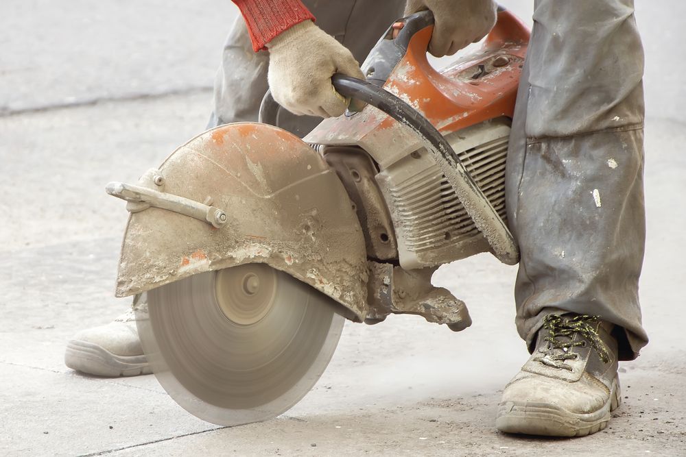 Worker Using a Circular Saw to Cut Concrete — Ultra Services Ground Pavement & Building in Dubbo, NSW