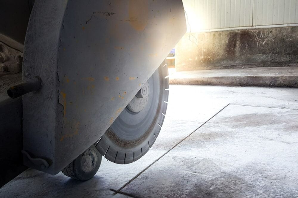 Concrete Saw Cutting a Line in A Concrete Surface — Ultra Services Ground Pavement & Building in Abercrombie, NSW