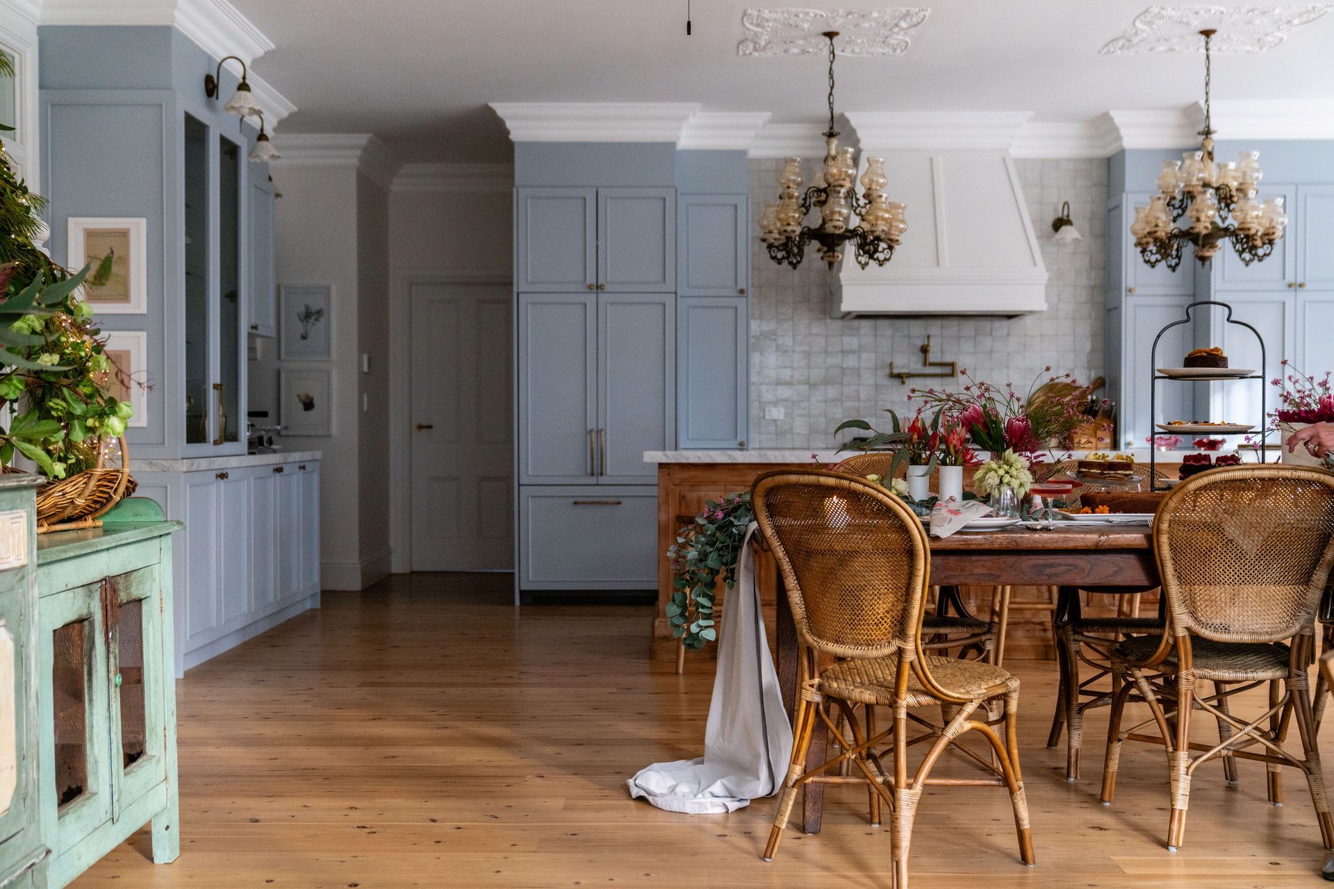 A Kitchen With White Cabinets, Black Stools, A Refrigerator And A Sink — Concept Design Kitchens & Joinery In Forster, NSW