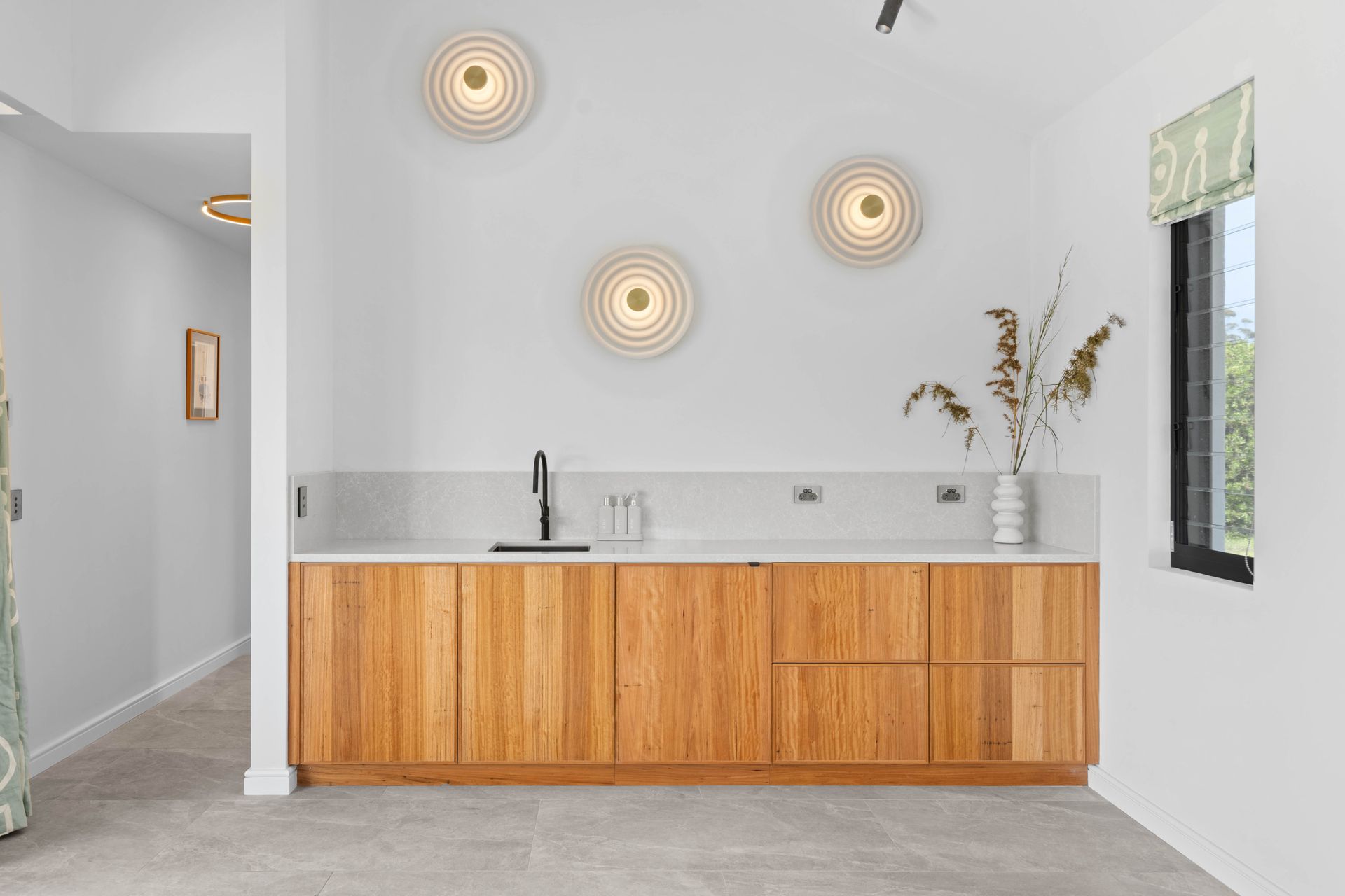A Kitchen Counter With A Concrete Counter Top And Wooden Cabinets — Concept Design Kitchens & Joinery In Taree, NSW 