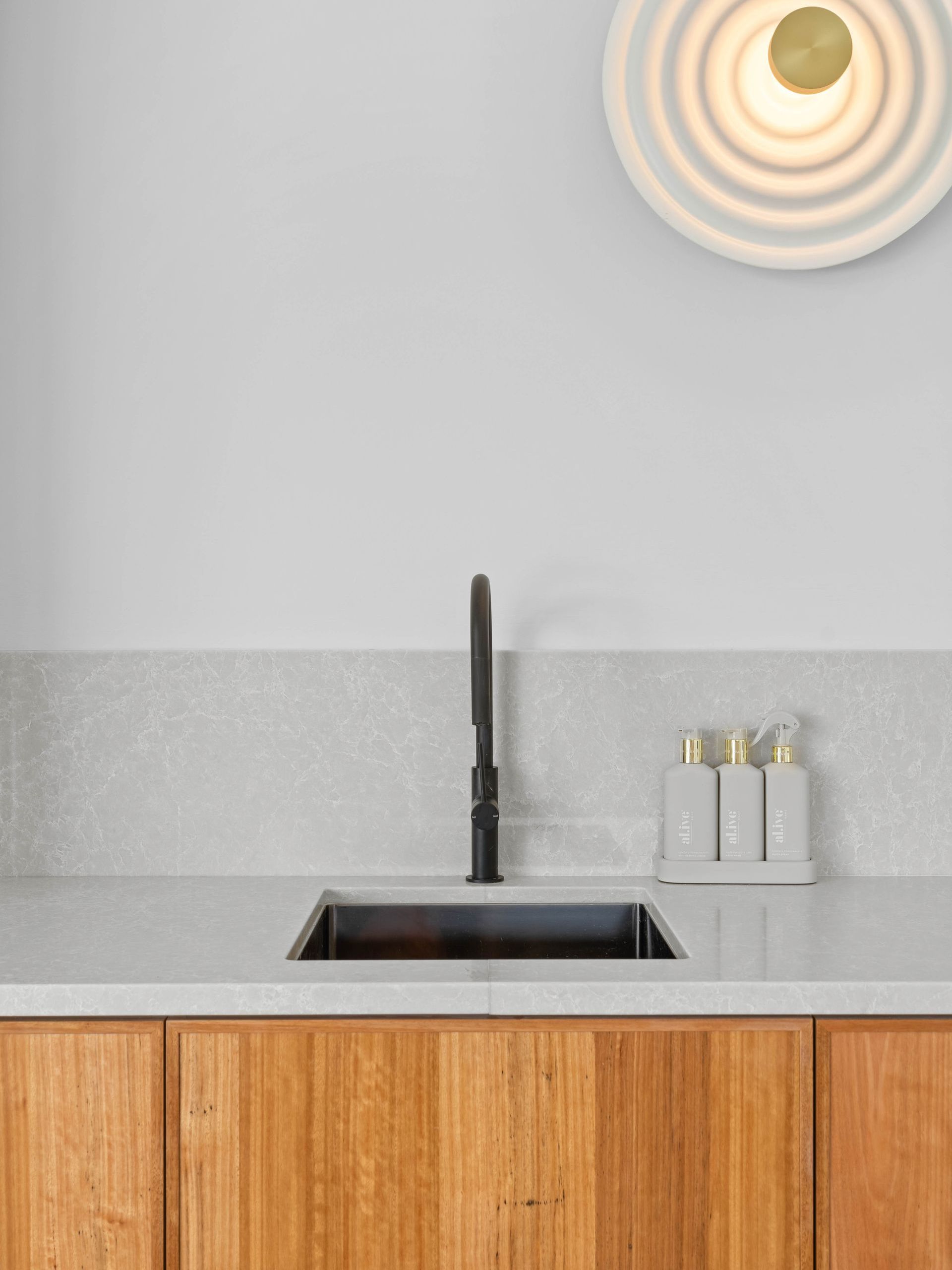 A Kitchen With A Large Island In The Middle Of It — Concept Design Kitchens & Joinery In Taree, NSW