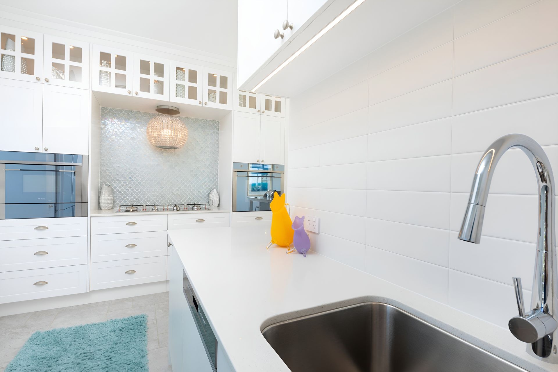 A Kitchen With A Large Island In The Middle Of It — Concept Design Kitchens & Joinery In Taree, NSW