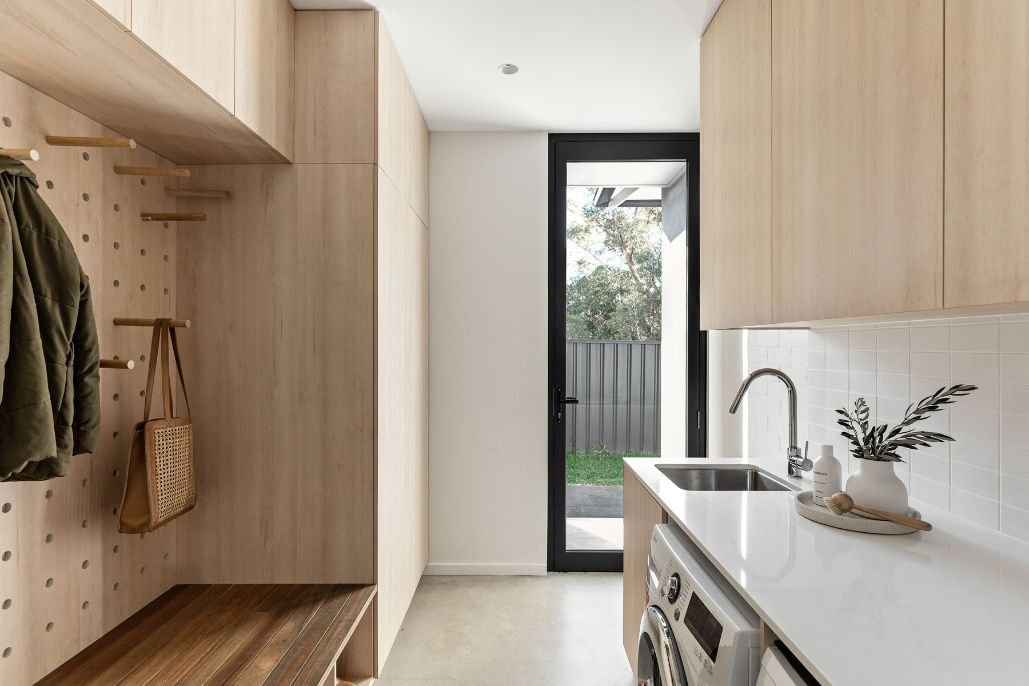 A Kitchen Counter With A Concrete Counter Top And Wooden Cabinets — Concept Design Kitchens & Joinery In Forster, NSW
