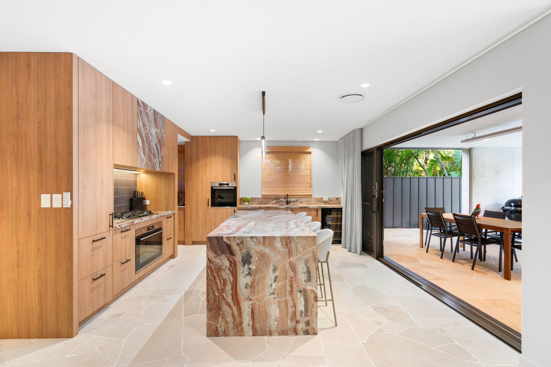 A Kitchen With White Cabinets, Black Stools, A Refrigerator And A Sink — Concept Design Kitchens & Joinery In Taree, NSW 