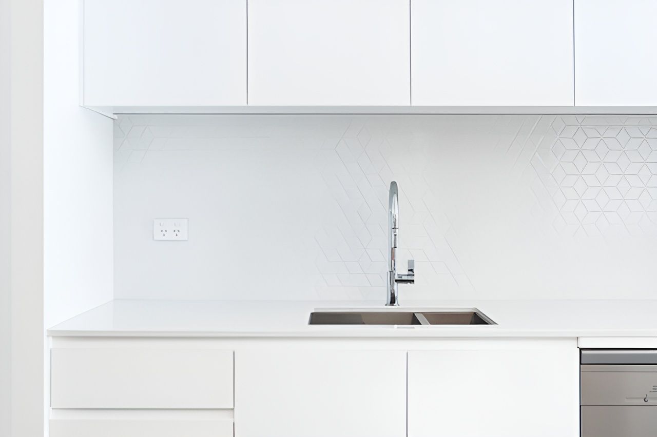 A Kitchen With White Cabinets, A Sink, And A Dishwasher — Concept Design Kitchens & Joinery In Taree, NSW