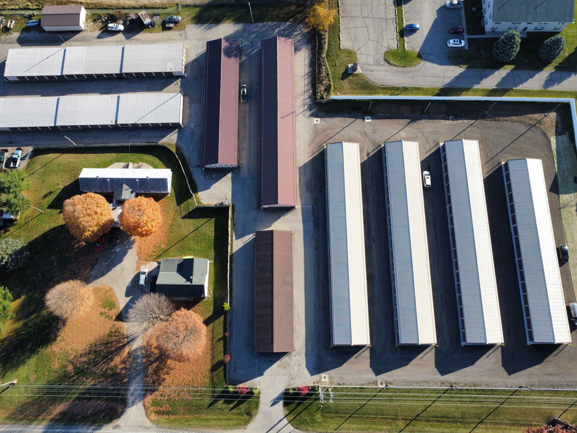 An aerial view of a row of trailers parked in a parking lot