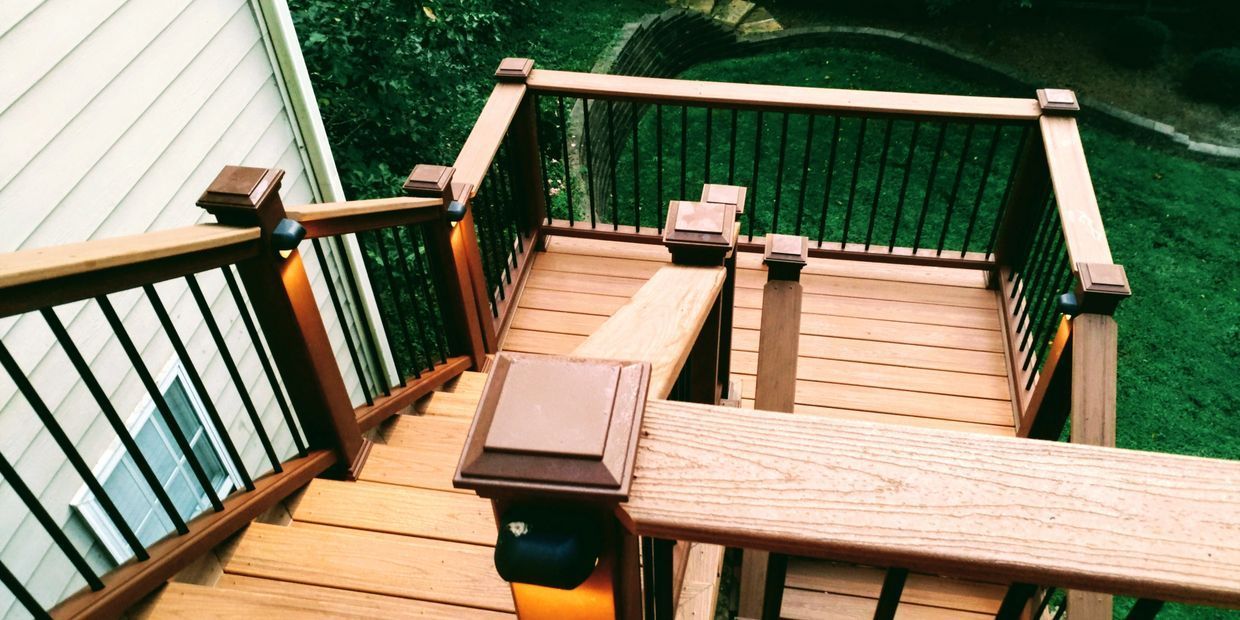 An aerial view of a wooden deck with stairs leading up to it.