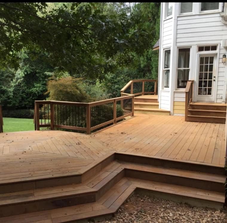 A wooden deck with stairs leading up to it