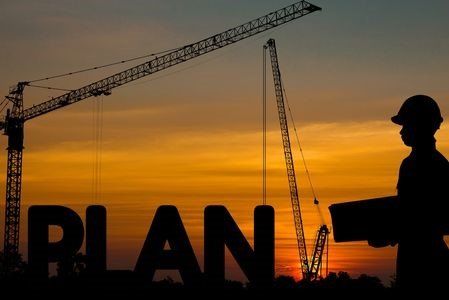 crane and workman on sunset background