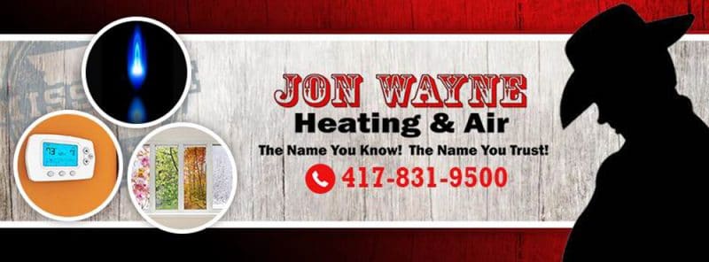 a man in a cowboy hat is standing in front of a sign for jon wayne heating and air .