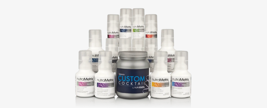Various bottles of skincare products against a white background.
