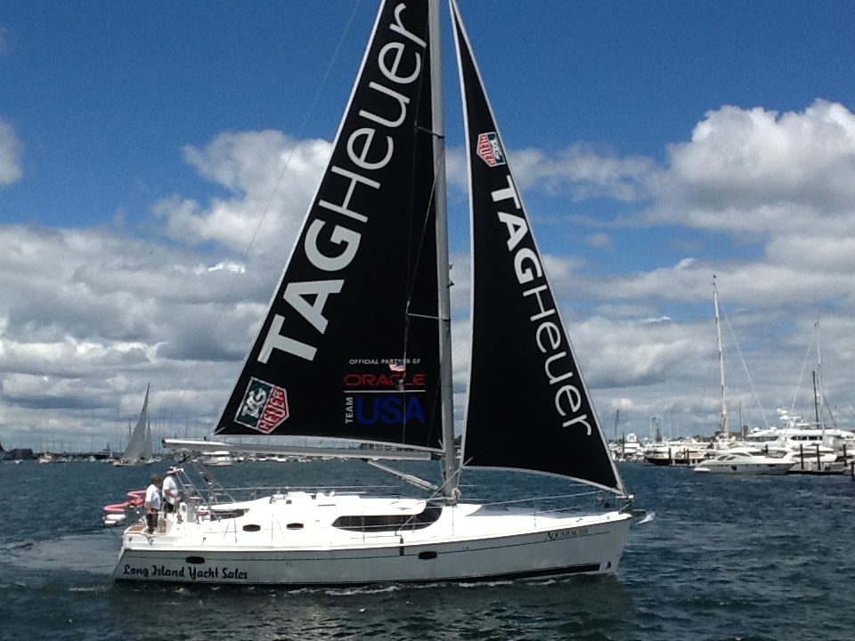 A sailboat with tagheuer written on the sail