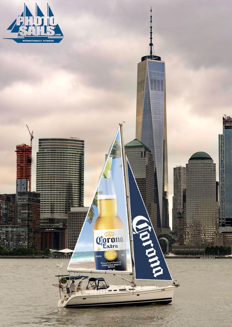 A sailboat with a corona beer advertisement on the sail