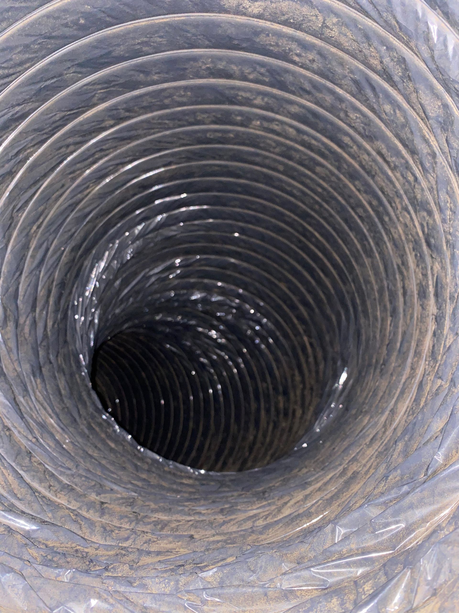 A close up of a duct with a hole in the middle