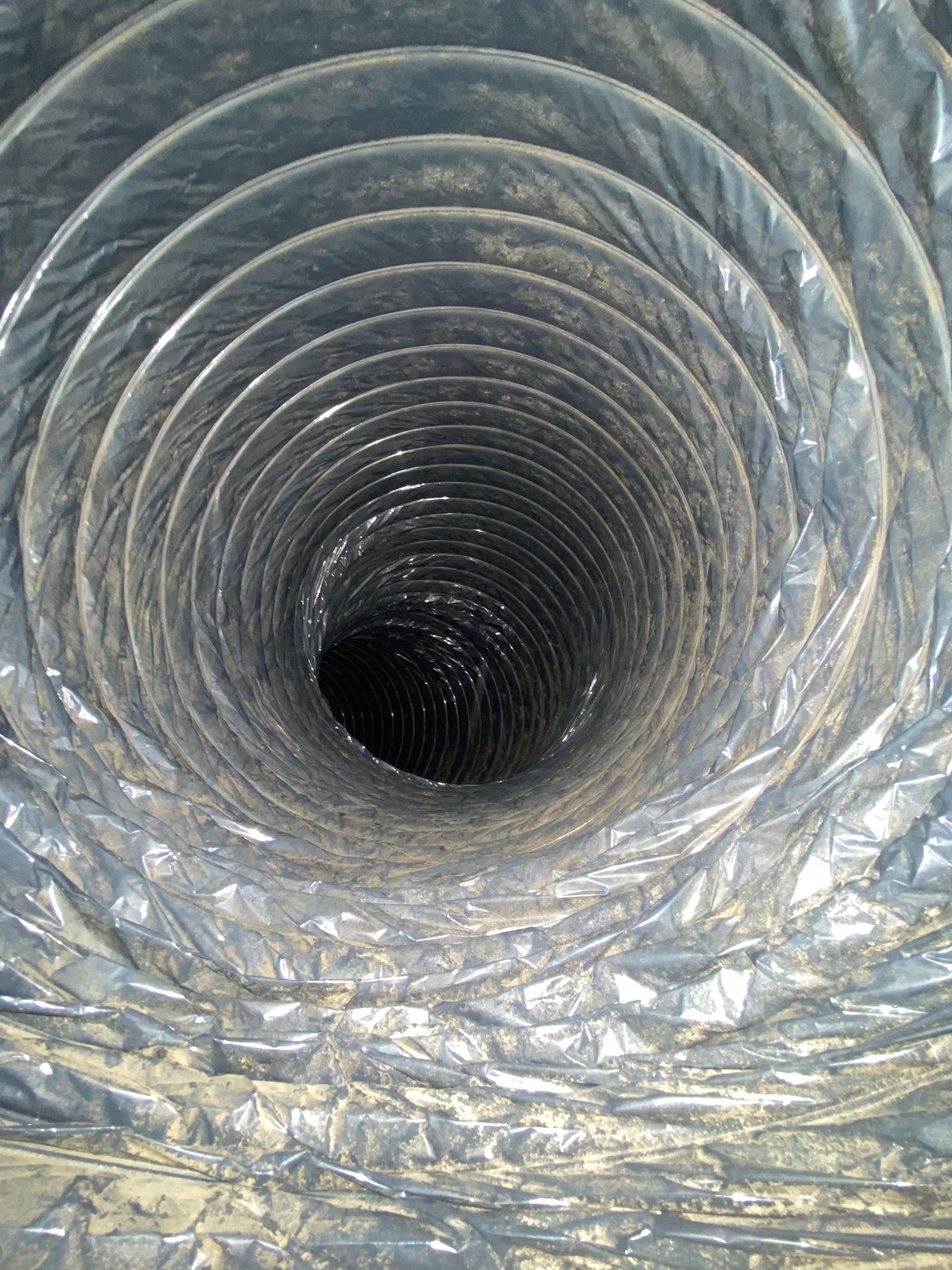 A close up of a duct with a hole in the middle