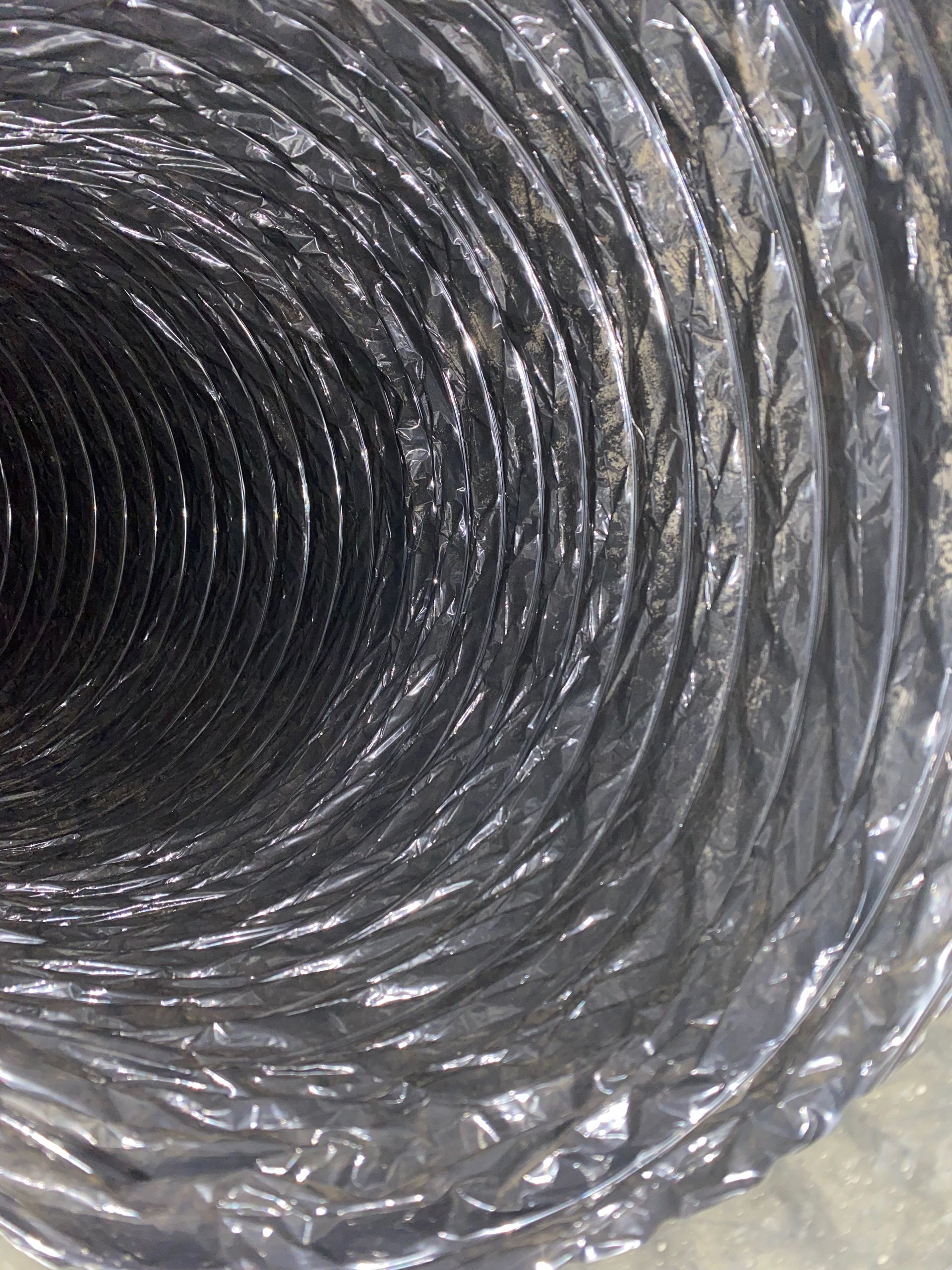 A close up of a duct that looks like a spiral.