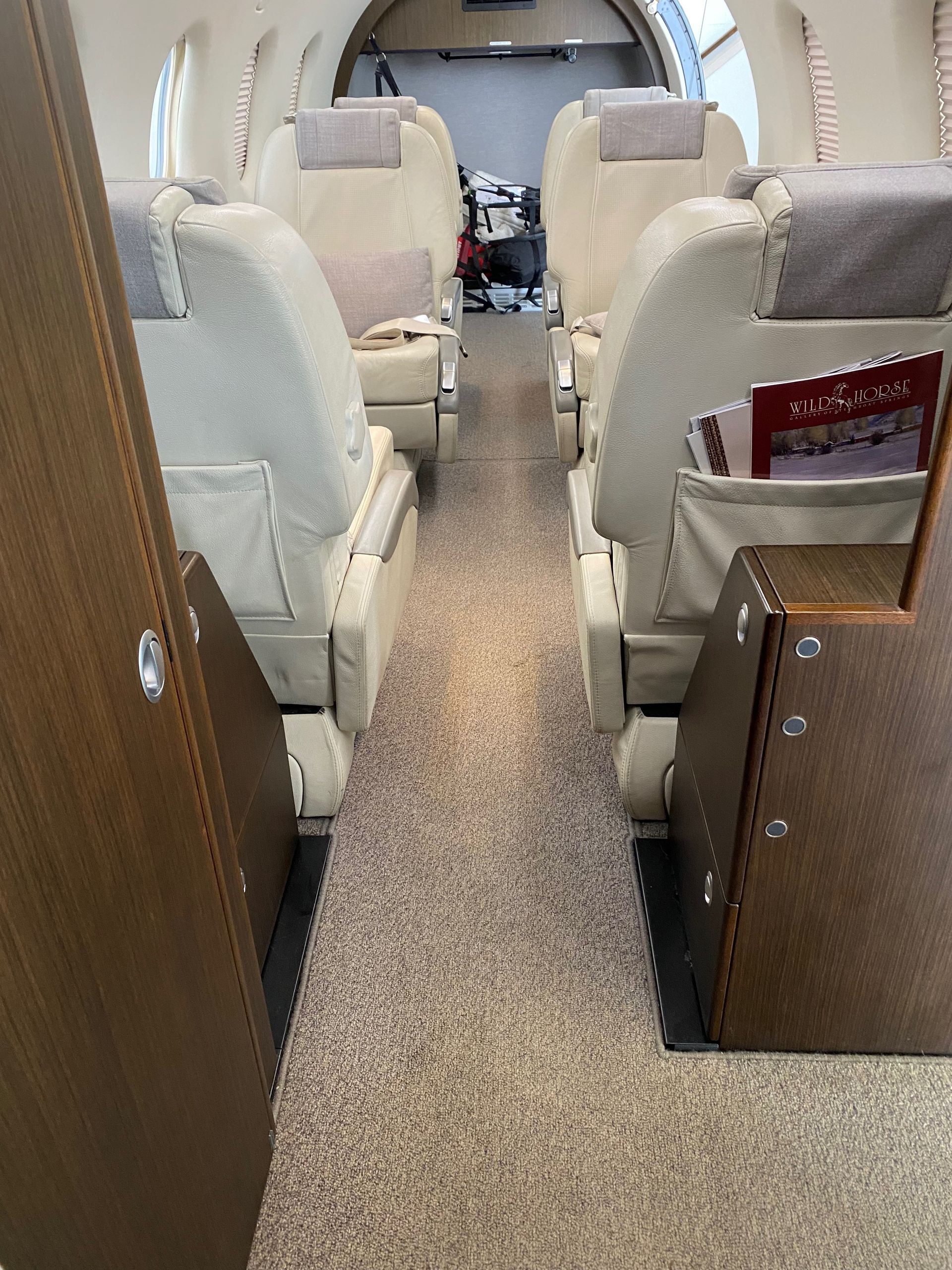 The inside of a plane with a tray that says ' priority ' on it