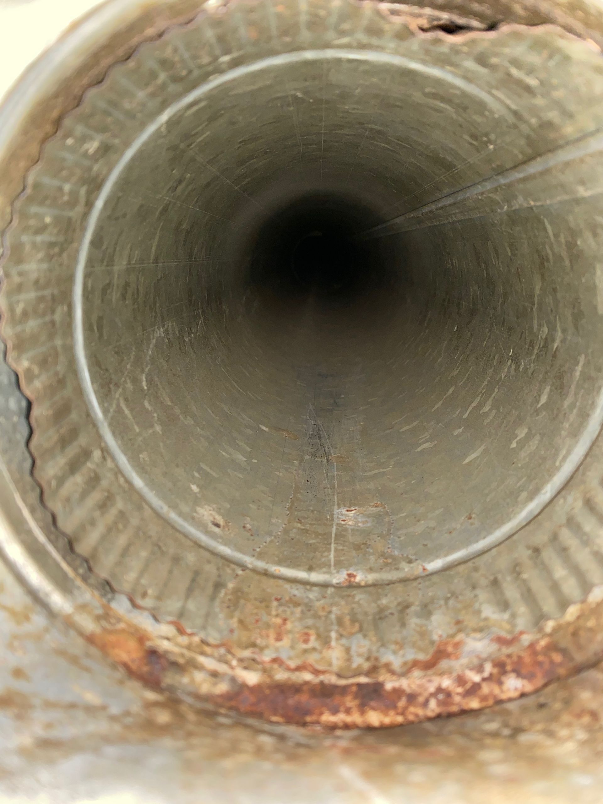 A close up of the inside of a metal pipe