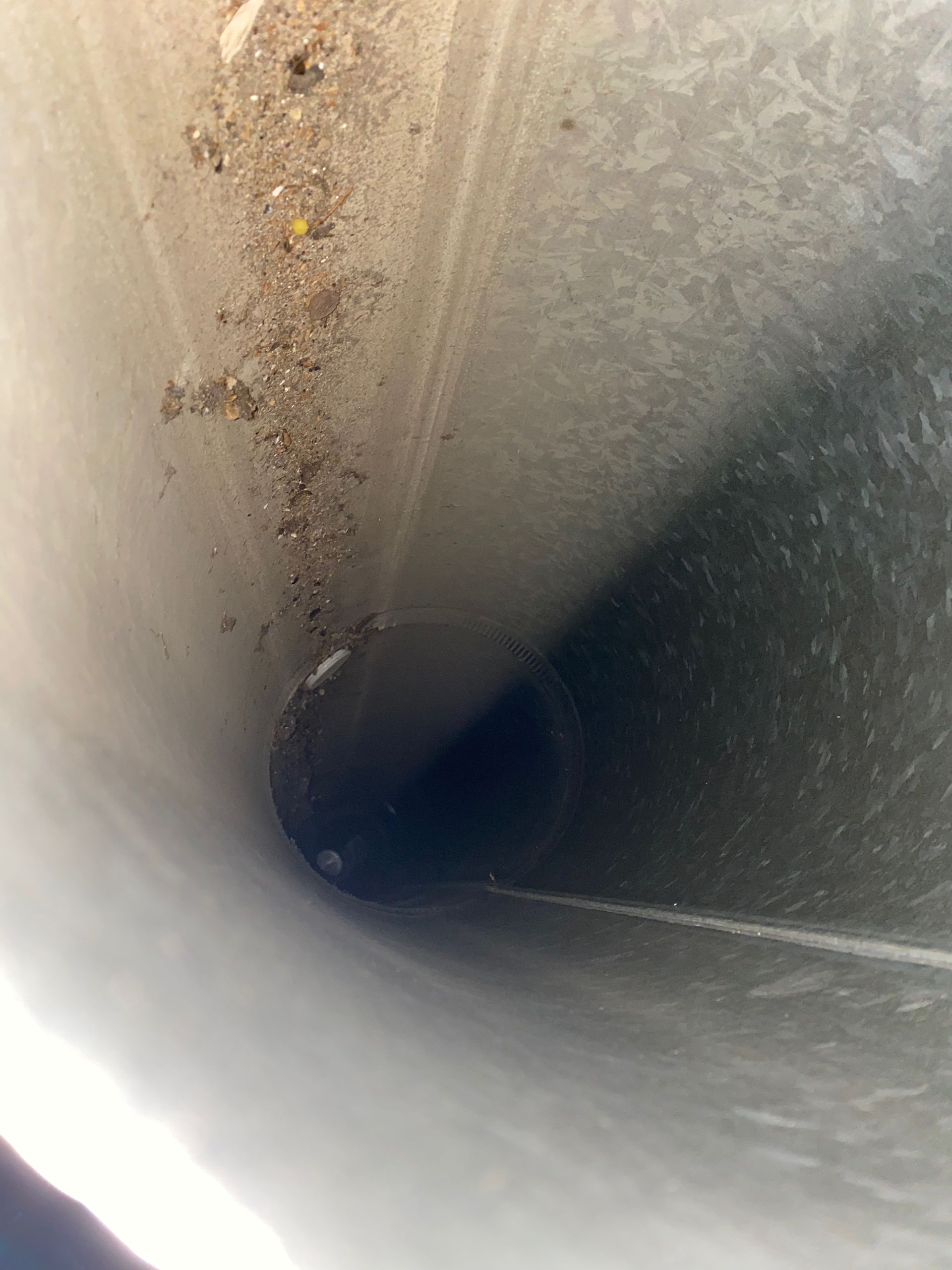 A close up of a pipe with a lot of dust on it.