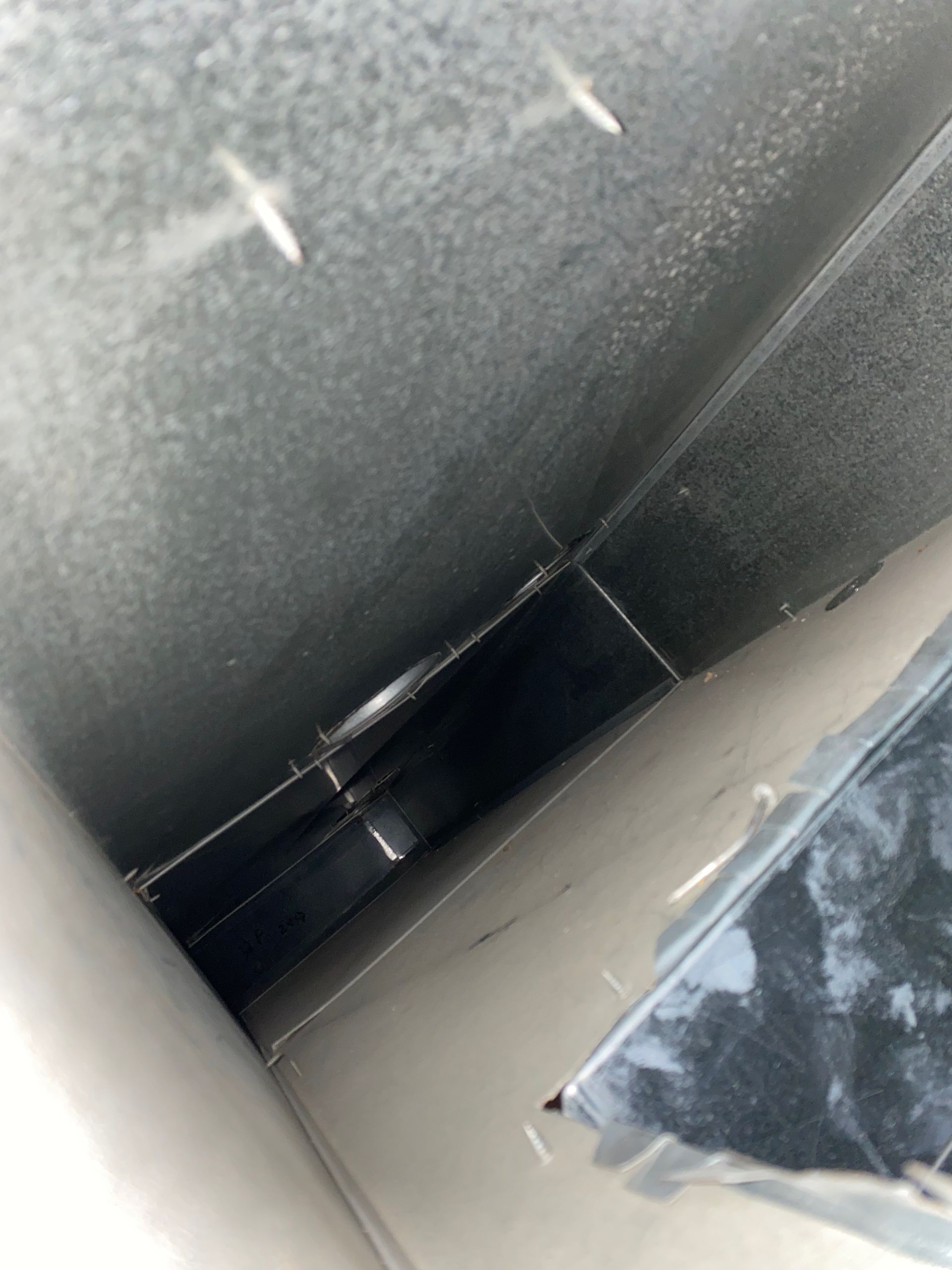 A close up of a metal pipe in a room.