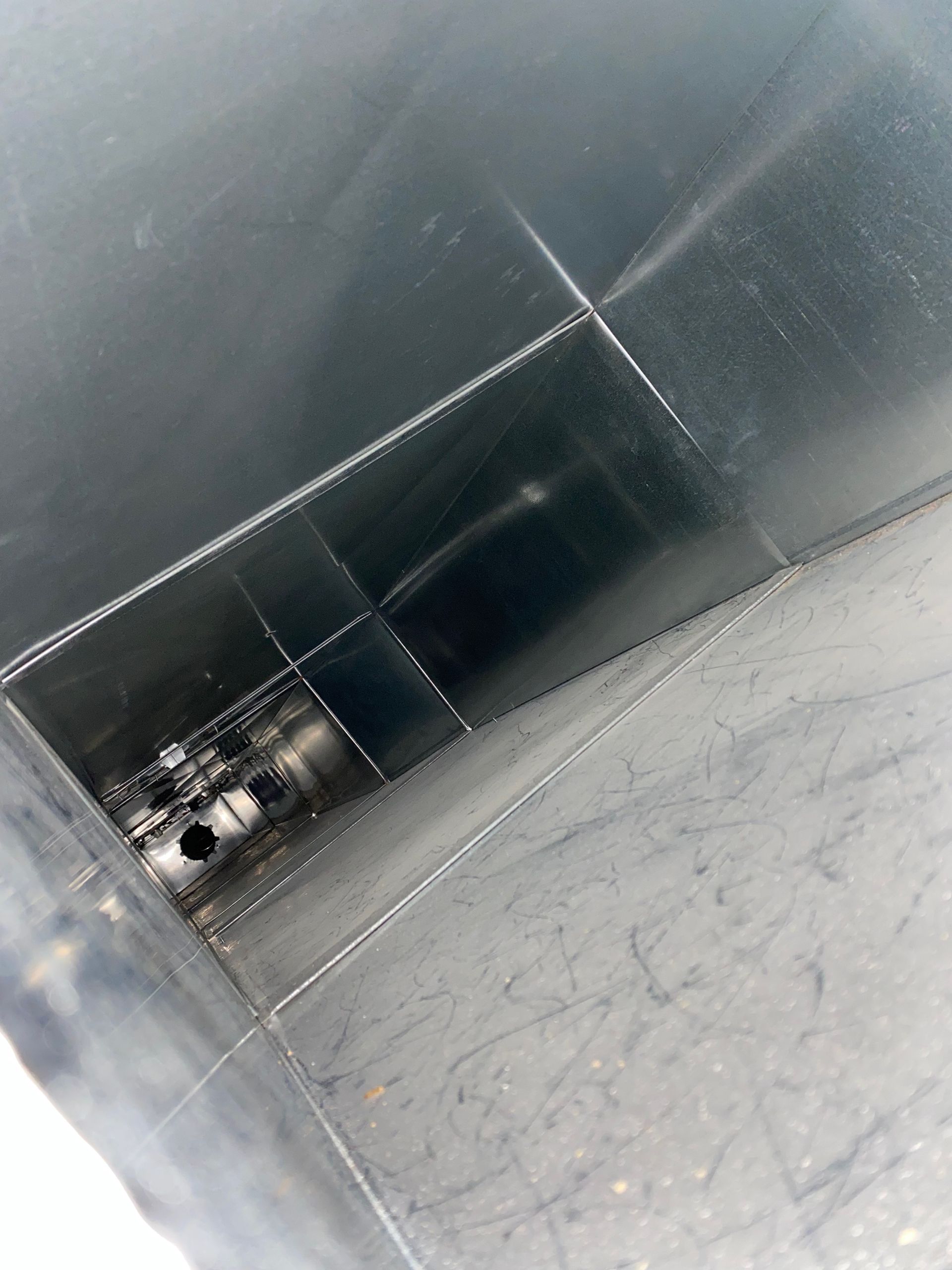 A black box with a hole in the middle of it