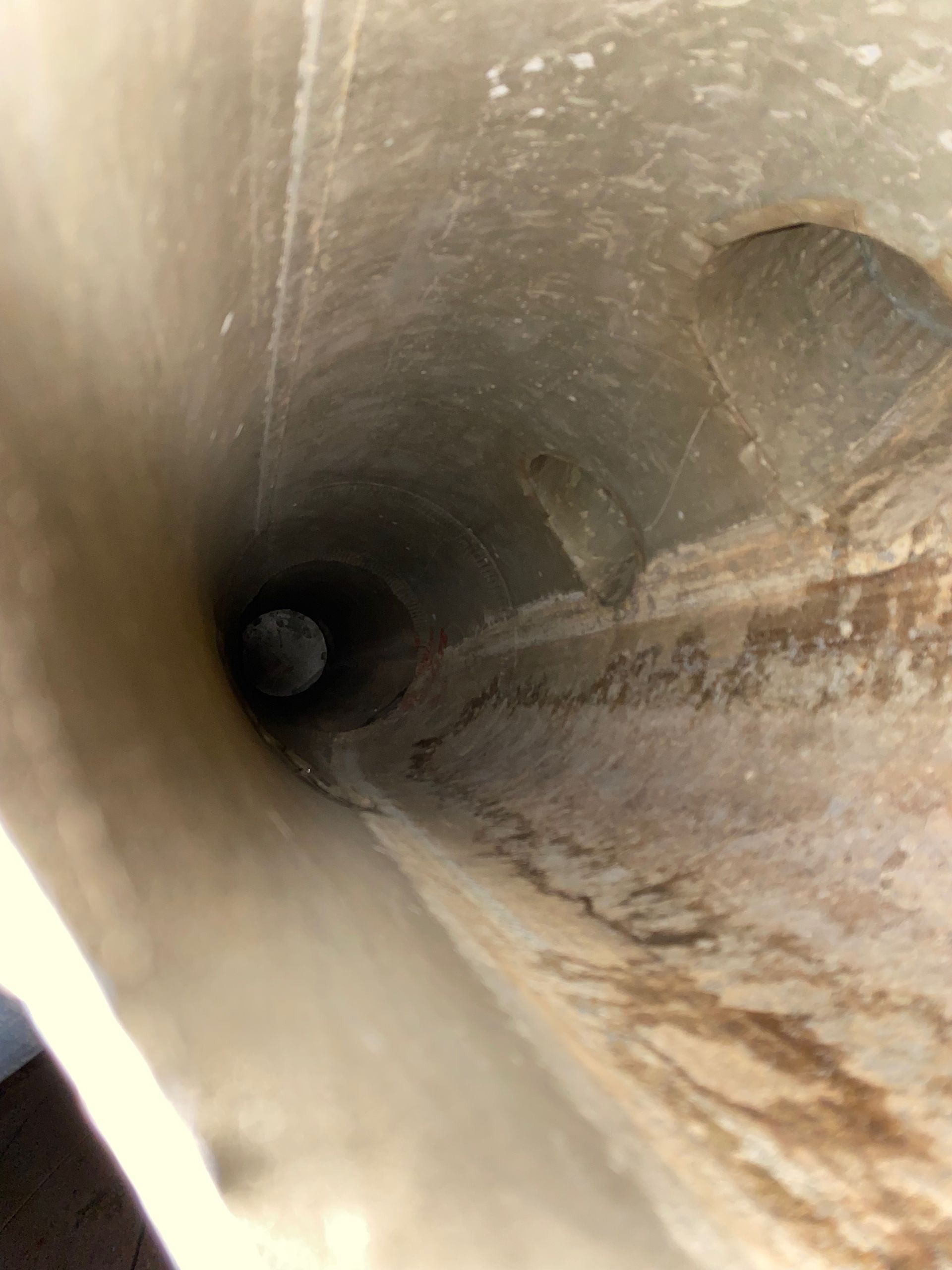 A close up of a tunnel with a hole in the middle.