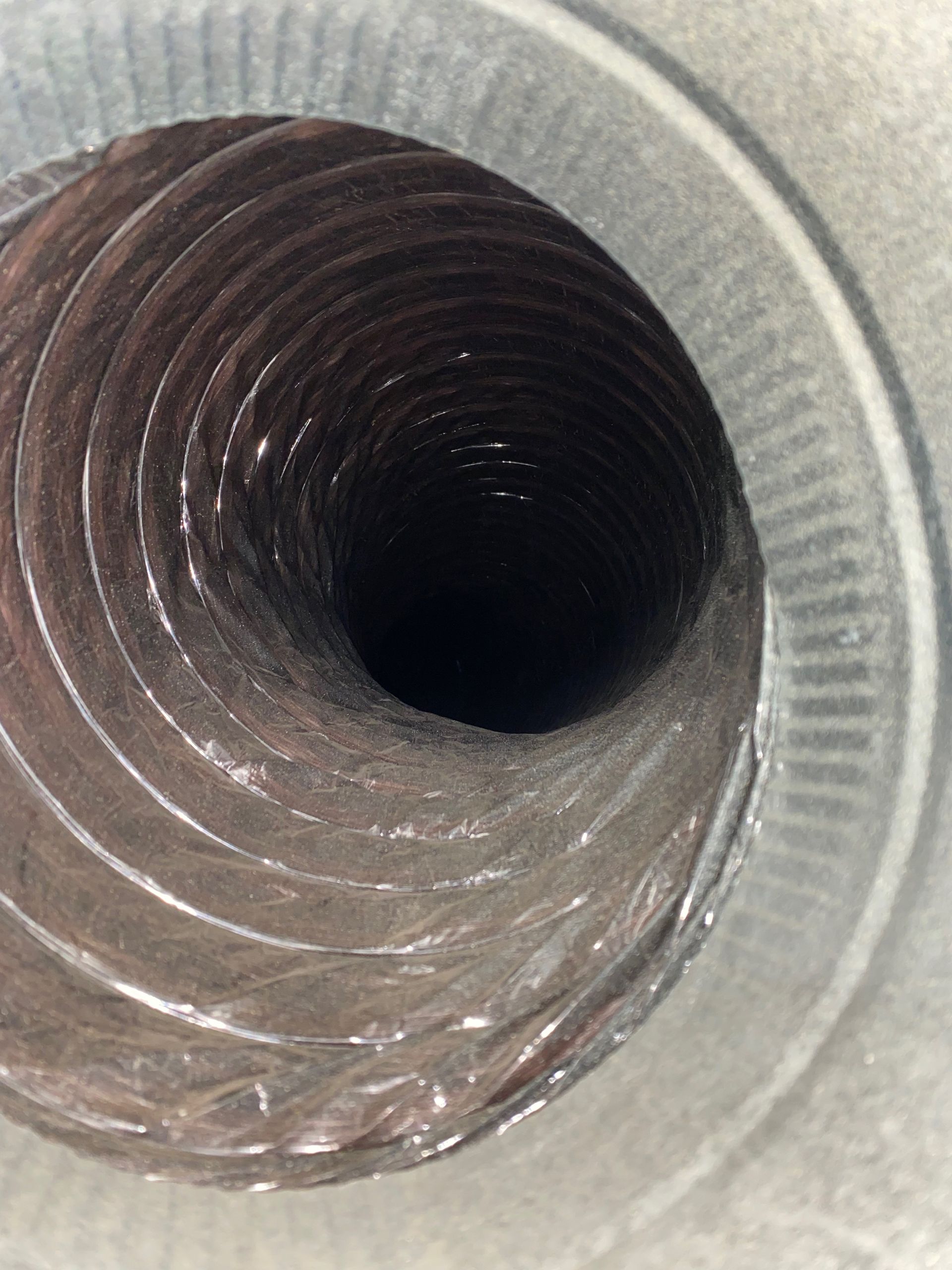 A close up of a duct with a hole in the middle