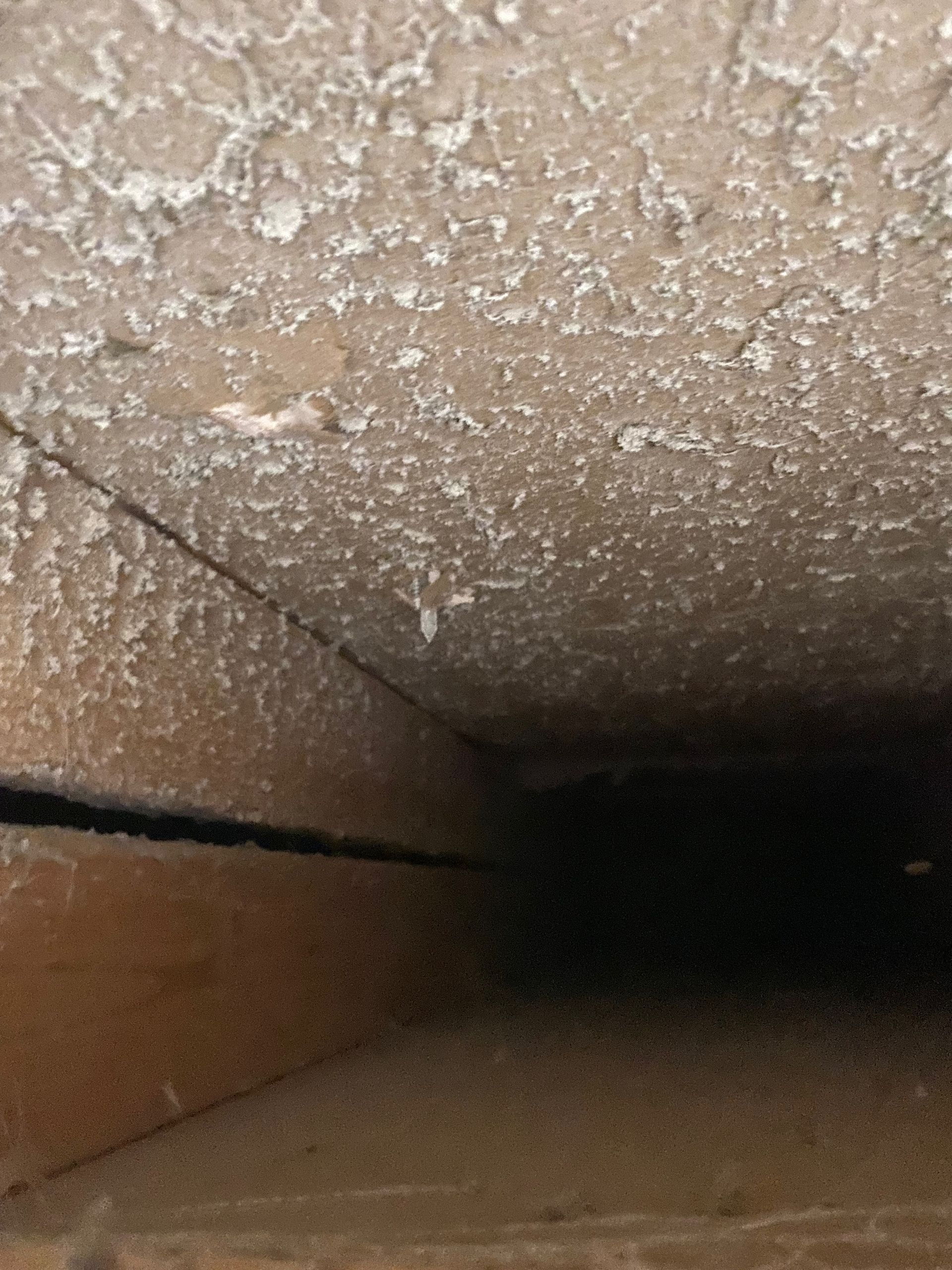 A close up of a ceiling with a few holes in it