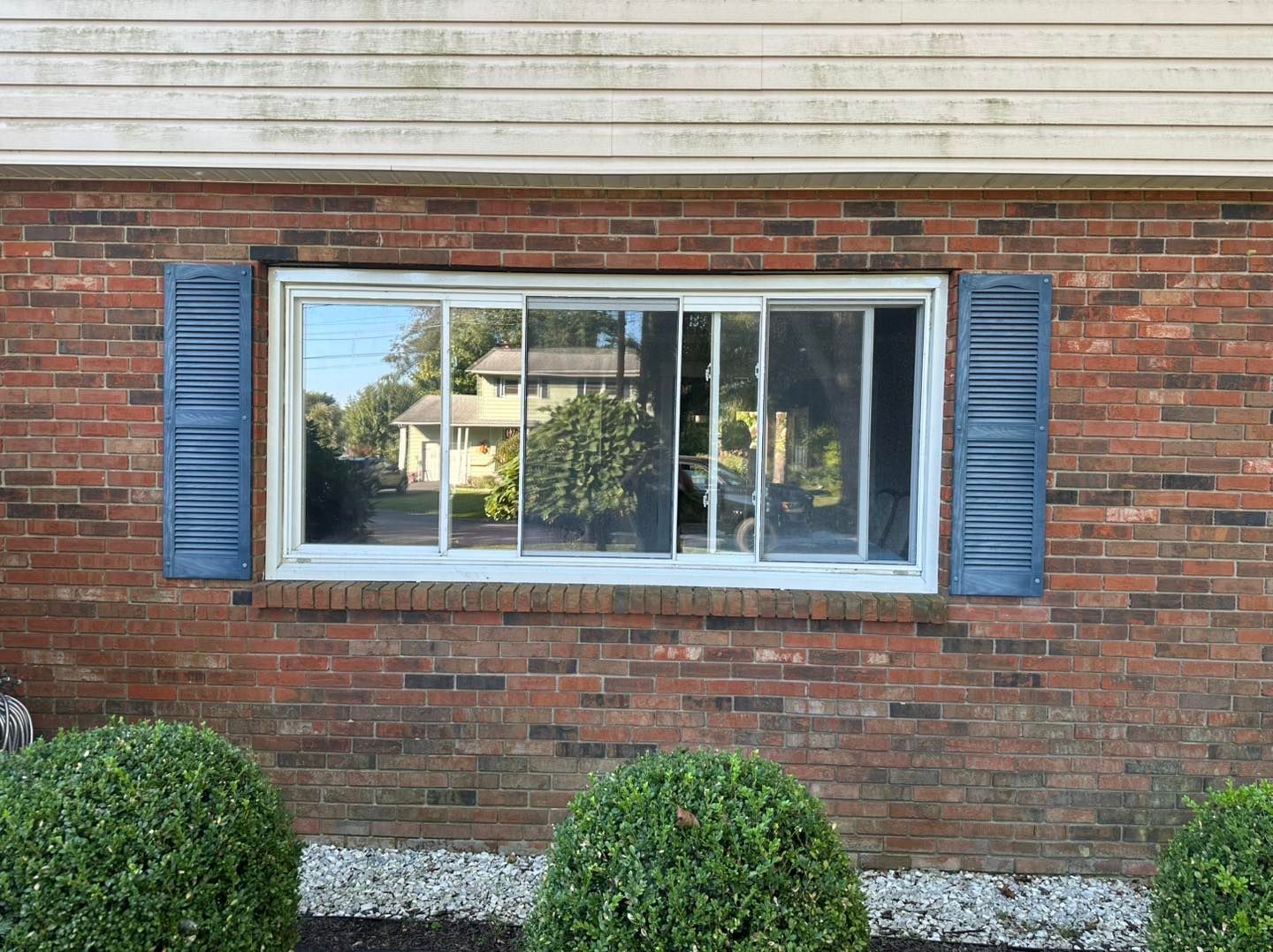 Aerial view of a winding river flowing through a dense, green forest.