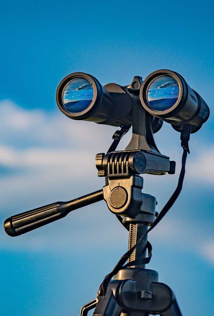 public binoculars with cloud background