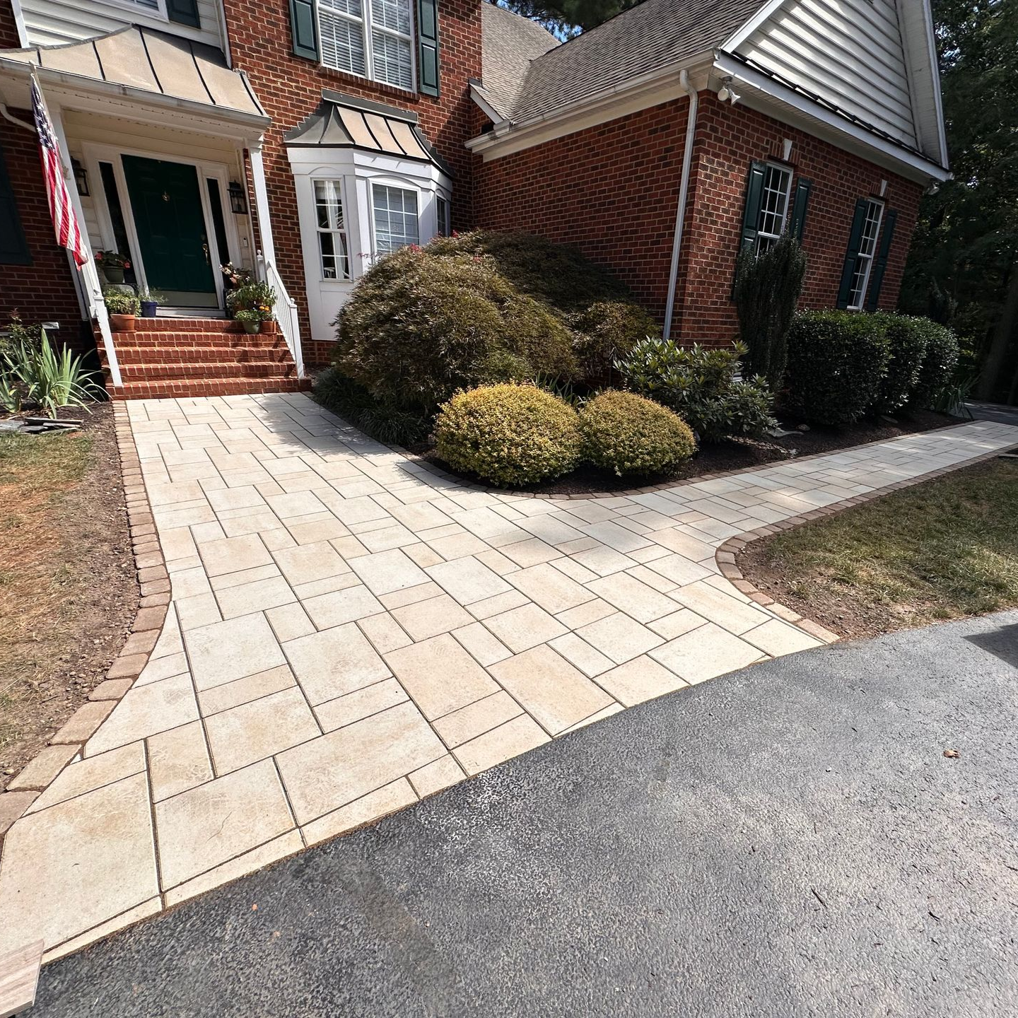 View of a beautiful yard at night, showcasing expert hardscape installation.