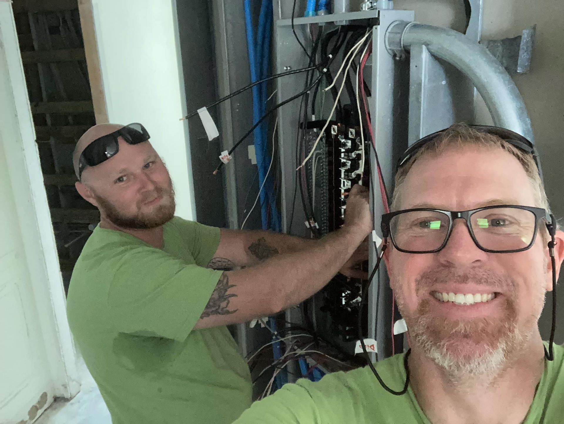 Team working on electrical panel board upgrades