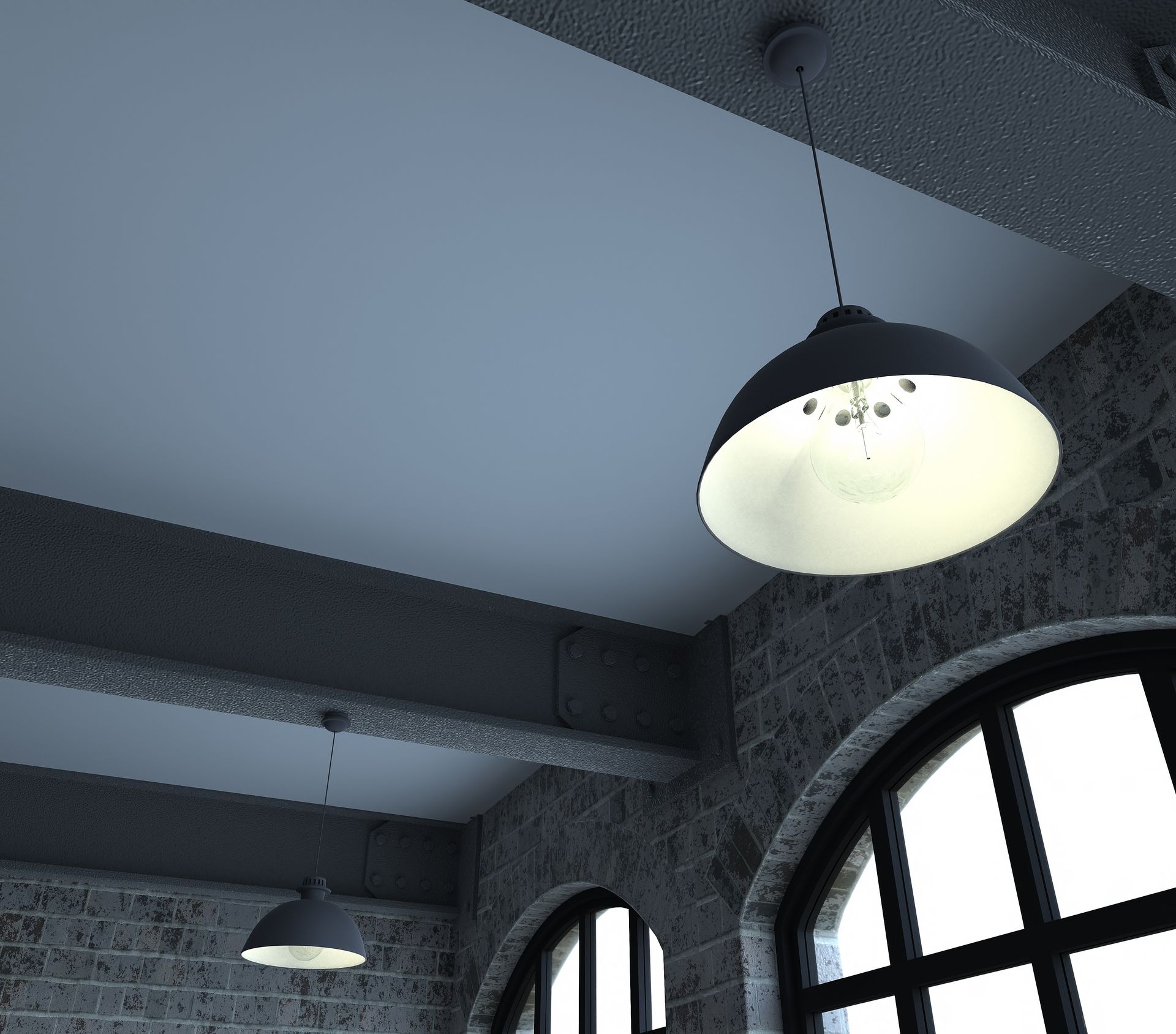 a light hanging from the ceiling in a dark room