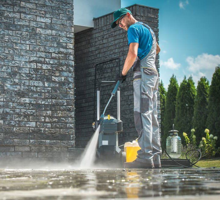 Man Cleaning Driveway - Hire Pressure Cleaners In Mount Isa, QLD