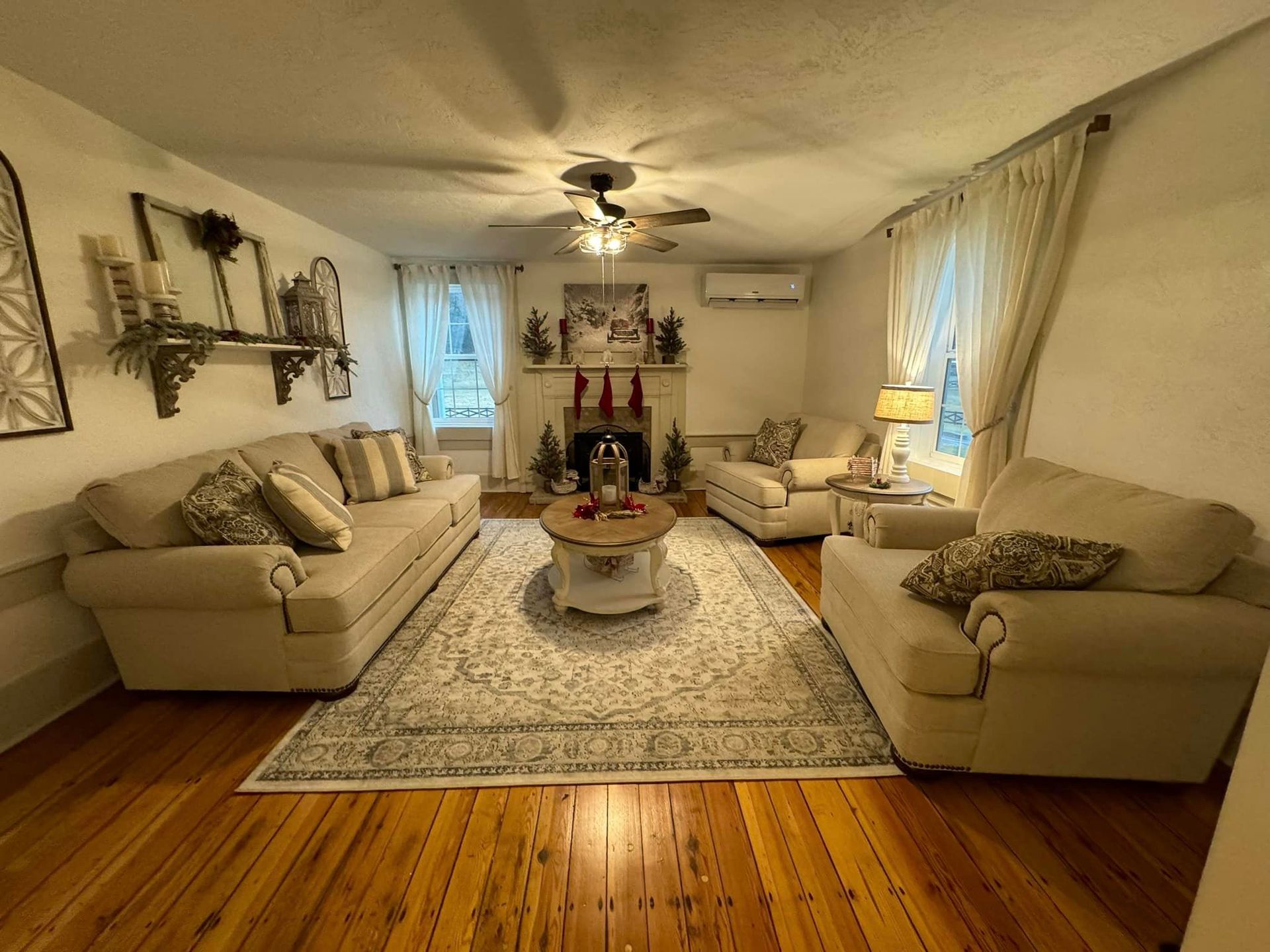 A living room filled with furniture and a fireplace