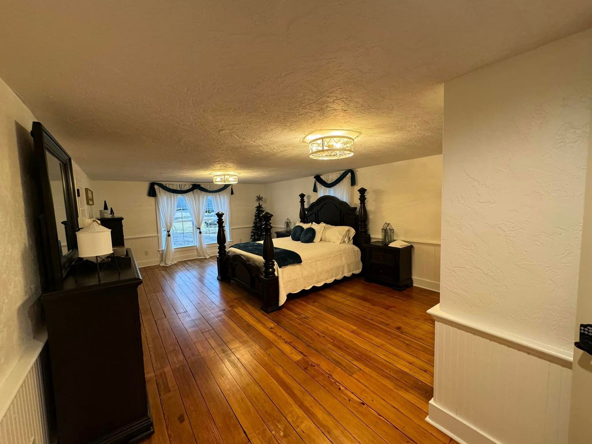 There is a large bed in the middle of the room.