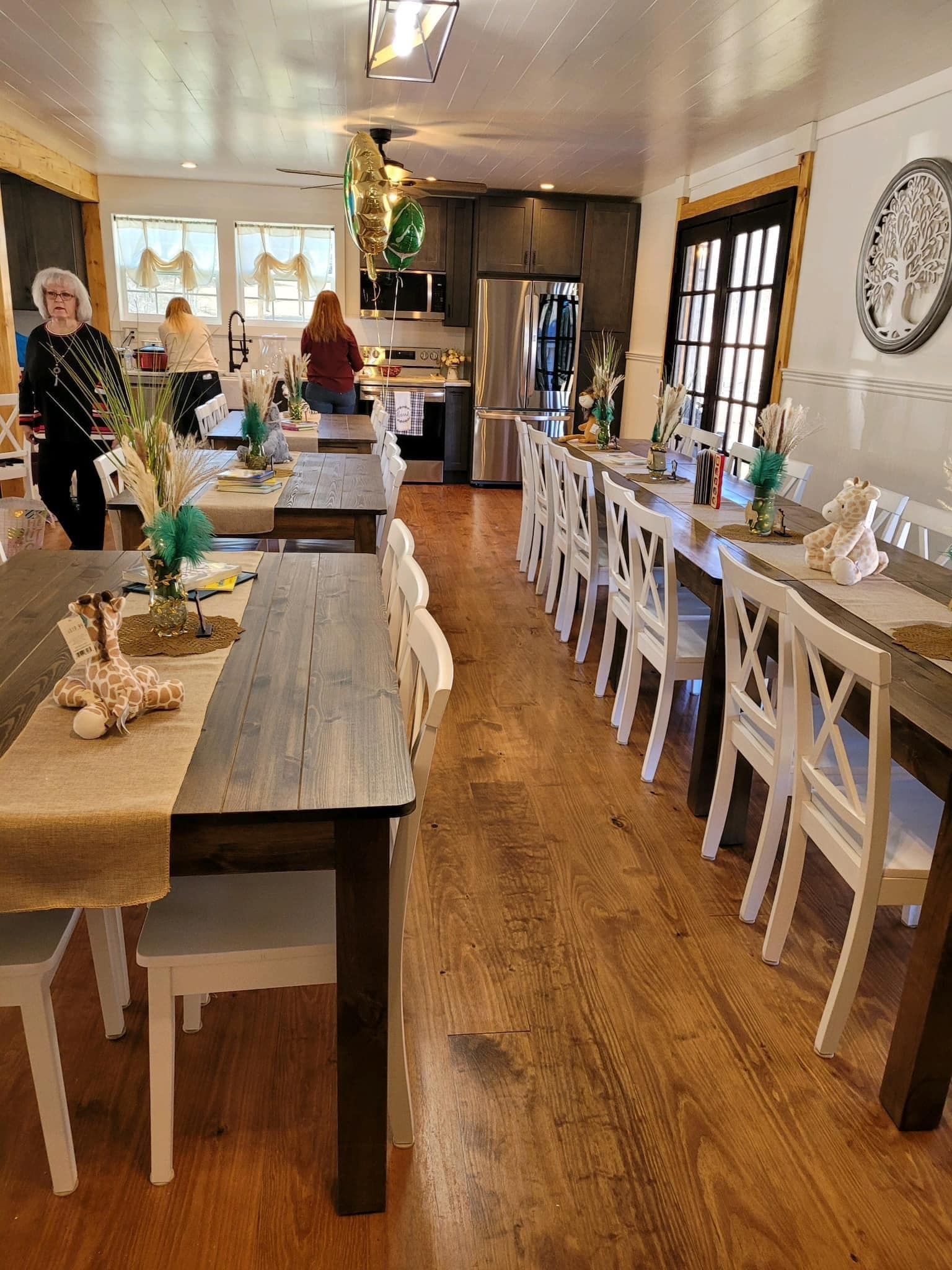 A long dining room filled with tables and chairs.