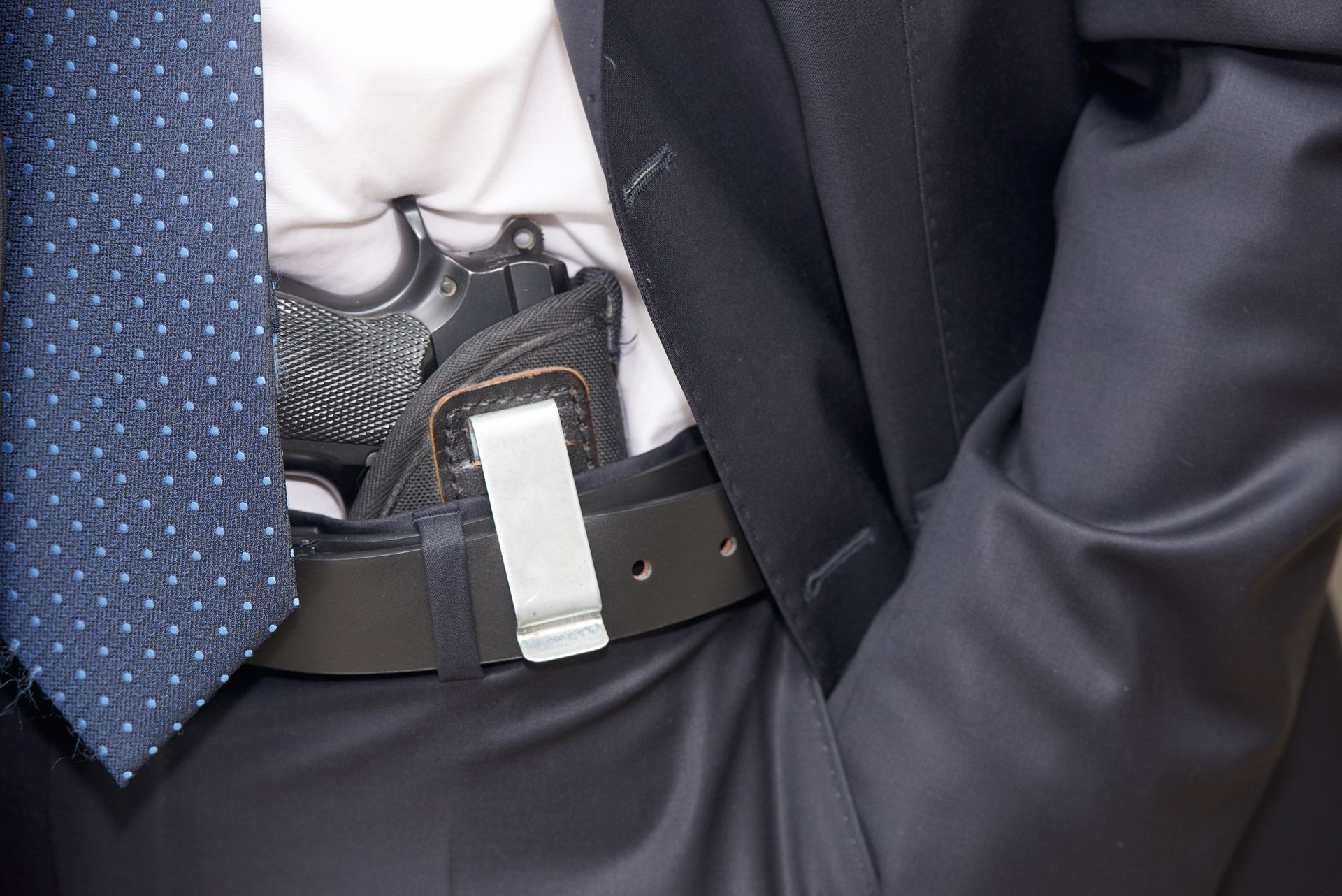 Person With A Gun On Pocket